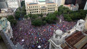 People protest against leading presidential candidate Jair Bolsonaro, at Cinelandia Square in Rio de Janeiro, Brazil, Saturday, Sept. 29, 2018. Bolsonaro has long been known for offensive comments about gays, women and black people, and he hasn't tempered his rhetoric during the campaign. He has also kept up his praise of Brazil's two-decade military dictatorship and promised to give police permission to shoot first and ask questions later.