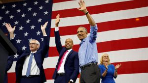 Barack Obama at a campaign rally in Milwaukee, Wisconsin, with governor-elect Tony Evers, Mandela Barnes and Sarah Godlewski on 26 October.