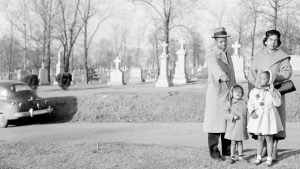 John A. Madison, great-grandson of Dred Scott, points to his ancestor's unmarked grave.