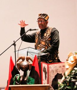 Ron Daniels, who held the first Kwanzaa celebration in Youngstown 50 years ago, speaks during a Kwanzaa celebration at New Bethel Baptist Church on Wednesday night.