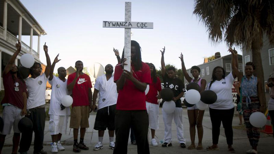 People pray outside Emanuel African Methodist Episcopal Church in Charleston, South Carolina, June 2015.