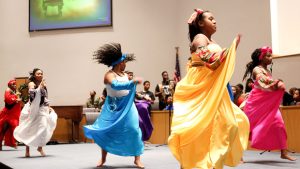 Dancers and drummers with the Harambee Youth Organization perform during a Kwanzaa celebration at New Bethel Baptist Church