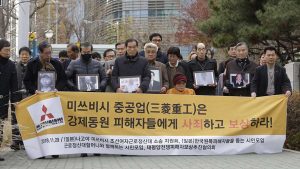 Victims of Japan’s forced labour and their family members at the supreme court in Seoul. Photograph: Ahn Young-joon/AP