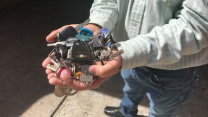 Luis Saavedra, 65, holds the keys to the apartments and vehicles he now cares for in Caracas after their owners fled overseas to escape the crisis.