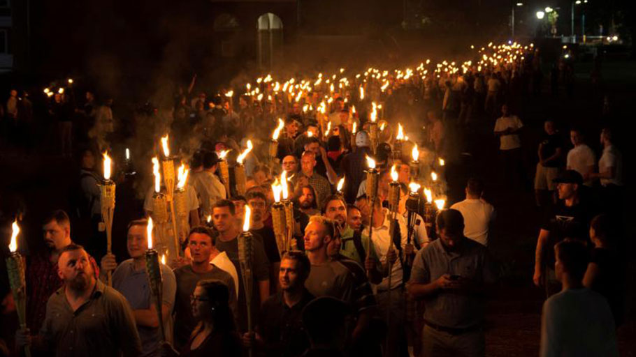 White nationalists carry torches on the grounds of the University of Virginia, on the eve of a planned rally in Charlottesville, Virginia, August 2017.
