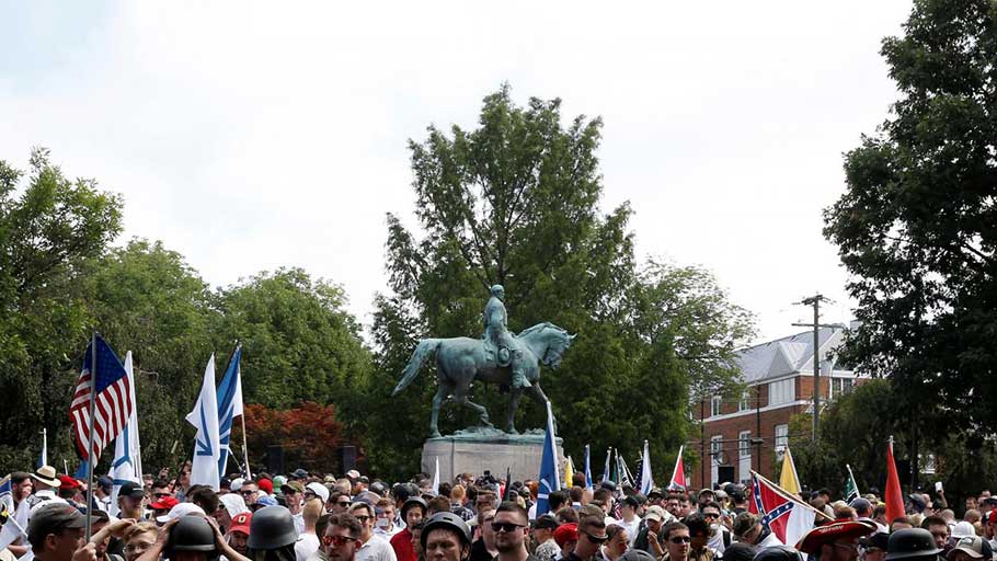 White supremacists gather under a statue of Robert E. Lee during a rally in Charlottesville, Virginia, August 2017.