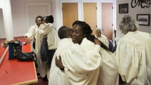 Women embrace in the Sweet Auburn District of the Old Fourth Ward. Image by Evey Wilson