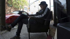 Ricci deForest, or better known as Ricci International in the beauty industry, sits outside of his beauty salon on Auburn Avenue and Hilliard Street. The space was one of Madam C.J. Walker's original beauty shop locations and was also home to WERD, the first black-owned radio station that Martin Luther King Jr. often used for his announcements. Image by Evey Wilson