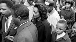 Family members and friends of the assassinated civil rights leader Dr. Martin Luther King Jr., follow his casket into an Atlanta funeral home. From left are: the Rev. A.D. Williams King; Dr. Ralph Abernathy; Coretta Scott King; and sons Martin Luther III, 10, and Dexter, 7. (AP Photo/Bill Hudson)