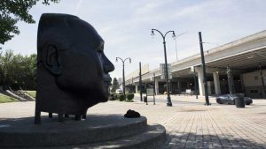 A bust of John Wesley Dobbs, a prominent civic leader who helped organize black voting power in Atlanta, looks out over the highway that was built through the business district he had dubbed "Sweet Auburn" in the Old Fourth Ward. Dobbs died in 1961 on the same day that Atlanta's schools were desegregated and the same year this highway was built. Image by Evey Wilson