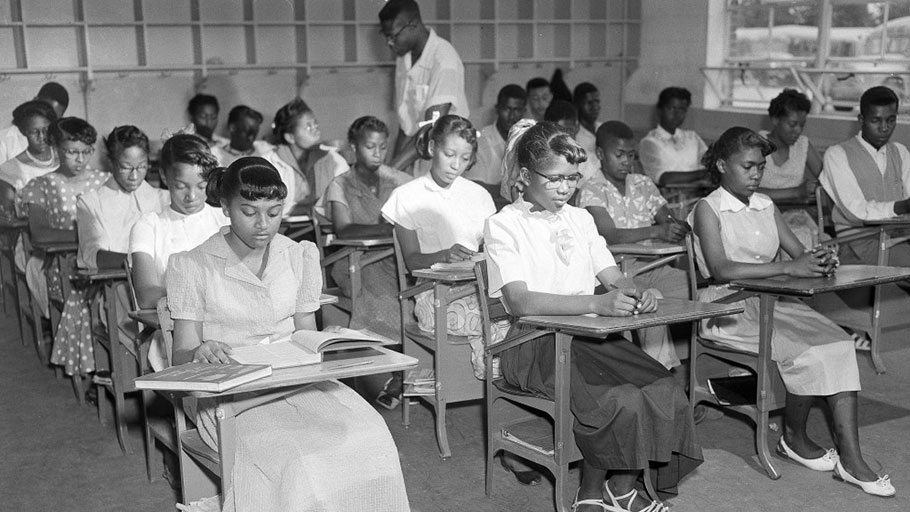 Henrietta Hilton, front left, daughter of tenant farmer William Hilton, and her fellow students, are seen in their ninth grade classroom in Summerton, S.C., June 4, 1954.