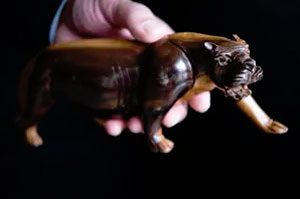 Speights holds a panther, which was a gift from the king and a family symbol.