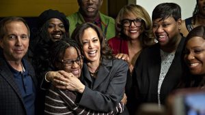 Sen. Kamala D. Harris (D-Calif.), a 2020 presidential candidate, poses for a photograph with attendees during a campaign stop in Des Moines.