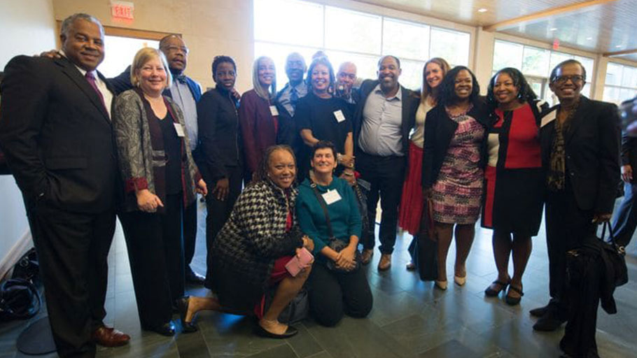 Charles J. Ogletree poses with current and former D.C. Public Defender Service employees.