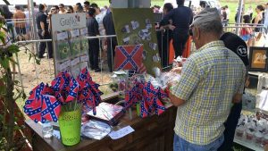 Vendors selling button and flags emblazoned with the Confederate Flag.