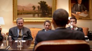 National Economic Council Director Larry Summers, Treasury Secretary Timothy Geithner, and Office of Management and Budget Director Peter Orszag look at President Barack Obama during an economic meeting in the Roosevelt Room of the White House, March 24, 2009.