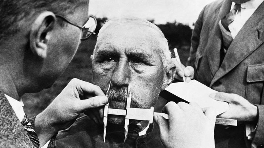 Nazi officials use calipers to measure an ethnic German's nose on January 1, 1941. The Nazis developed a pseudoscientific system of facial measurement that was supposedly a way of determining racial descent.