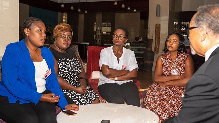 NNPA President and CEO, Dr Benjamin F. Chavis, Jr., (far right) invited Kettie Kamwangala (far left) and other Malawian women leaders for an open discussion while the ballots were being counted after a historic voter turnout across Malawi.