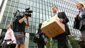 A UK employee of Lehman Brothers carrying a box after clearing his desk when the US investment firm declared bankruptcy, London, September 15, 2008