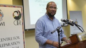 Dr. Ahmed Reid giving his presentation at the press conference.