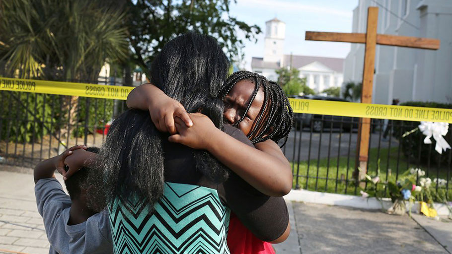 Kearston Farr comforts her daughter, Taliyah, outside the Charleston, South Carolina, church where Dylann Roof killed nine people.