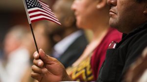 Detail of an American flag held by a newly naturalized citizen during a U.S. citizens naturalization ceremony in Atlanta on Aug. 10, 2016.