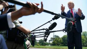 President Donald Trump talks to journalists after returning to the White House July 30 in Washington, DC.