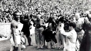 Defiant: Jesse Owens after winning the 100m at the Berlin Olympics, August 1936