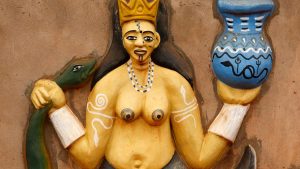 A relief sculpture of the goddess Mami Wata on the wall of a voodoo temple in Benin.