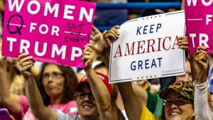 A group of Trump supporters display their "Women For Trump" and "Keep America Great" signs during the "Make America Great Again" rally held at the Mohegan Sun Arena.