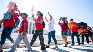 Immigration activists gather outside the supreme court