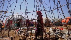 A Somali woman walks in a camp for internally displaced people on Dec. 18, 2018, as hundreds of people fled from southern Somalia while the U.S. conducted airstrikes against the Shabab.