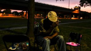 As night falls, Kendo relaxes near I-81 with friends and neighbors.