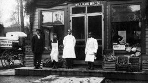 The Williams brothers stand outside their grocery store in Syracuse's 15th Ward in 1920. The neighborhood was once home to many businesses owned by African Americans.