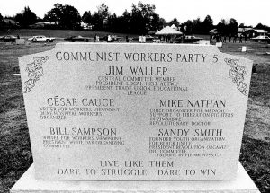 A memorial marker displays the names of the victims of the November 3, 1979 massacre.