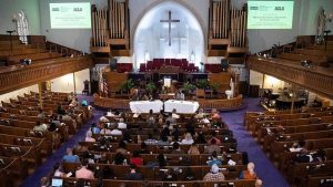 People attend the The National African American Reparations Commission and the American Civil Liberties Union's forum to discuss "reparations as the country continues to reel from the impact of slavery and its legacy," at the Metropolitan AME Church in Washington, DC, on June 19, 2019.