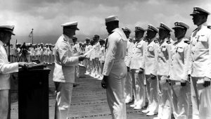 Doris Miller receives the Navy Cross from Adm. Chester W. Nimitz at Pearl Harbor on May 27, 1942.