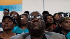 Voters listen to the Democratic presidential candidate Hillary Clinton speak on 12 February 2016 in Denmark, South Carolina.