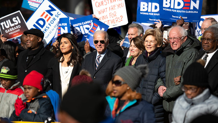 Jaime Harrison with presidential candidates Tulsi Gabbard, Joe Biden, Amy Klobuchar, Elizabeth Warren and Bernie Sanders in Columbia, South Carolina.