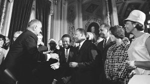 President Lyndon B. Johnson meets with Martin Luther King, Jr. at the signing of the Voting Rights Act of 1965. August 6, 1965.