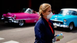 A woman wears a mask as a precaution against the spread of the new coronavirus at the Jose Marti International Airport in Havana, Cuba,