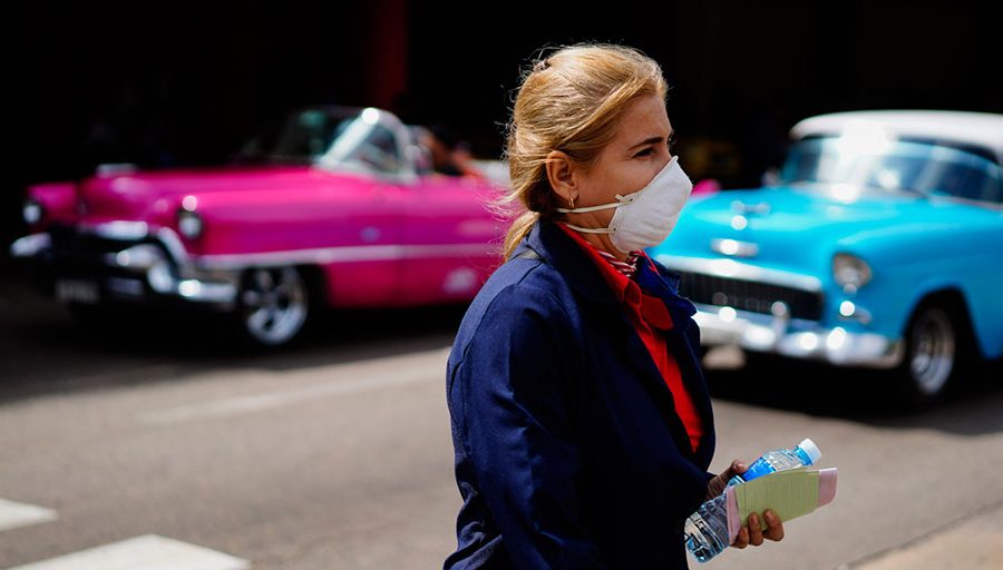 A woman wears a mask as a precaution against the spread of the new coronavirus at the Jose Marti International Airport in Havana, Cuba,