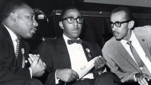 The Rev. Martin Luther King Jr., left, meets with the Rev. Joseph E. Lowery, center, and the Rev. Wyatt Tee Walker at First African Baptist Church in Richmond, Va., for the Southern Christian Leadership Conference convention on Sept. 25, 1963.