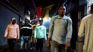 Africans walk in the "Little Africa" district of Guangzhou, China on Mar. 1, 2018.