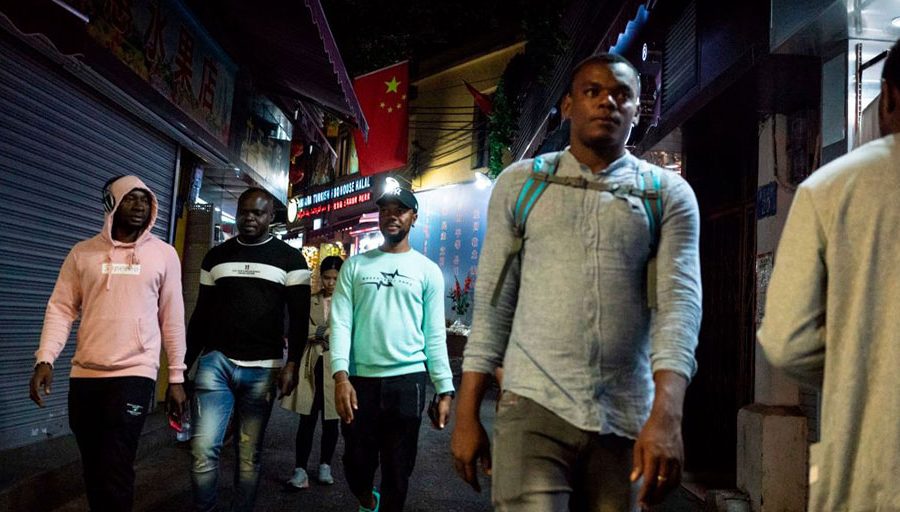 Africans walk in the "Little Africa" district of Guangzhou, China on Mar. 1, 2018.