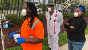 Charlotte, N.C., sanitation workers, UE Local 150, at April 7 protest over lack of protective gear, after the COVID-19 death of sanitation worker Adrian Grubbs. Charlotte chapter president Dominic Harris speaks at press conference with Chief Steward Craig Brown and Recording Secretary Nichel Dunlap Thompson.