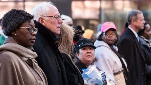 Democratic presidential candidate Sen. Bernie Sanders (I-VT) (2nd L) marches in the King Day at the Dome parade January 18, 2016 in Columbia, South Carolina.