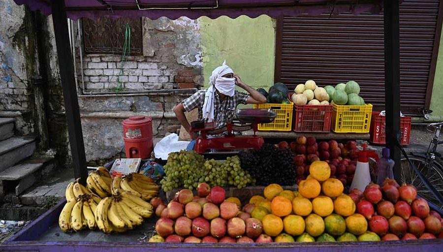 A fruit vendor waiting for customers during lockdown in Prayagraj, India. About 2 billion people worldwide work in the informal economy