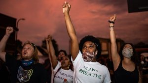 Protesters chant “Say His Name — George Floyd!” near a memorial for George Floyd in Minneapolis on June 2.