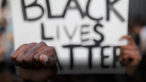 Black Fist and Black Lives Matter sign at George Floyd protest